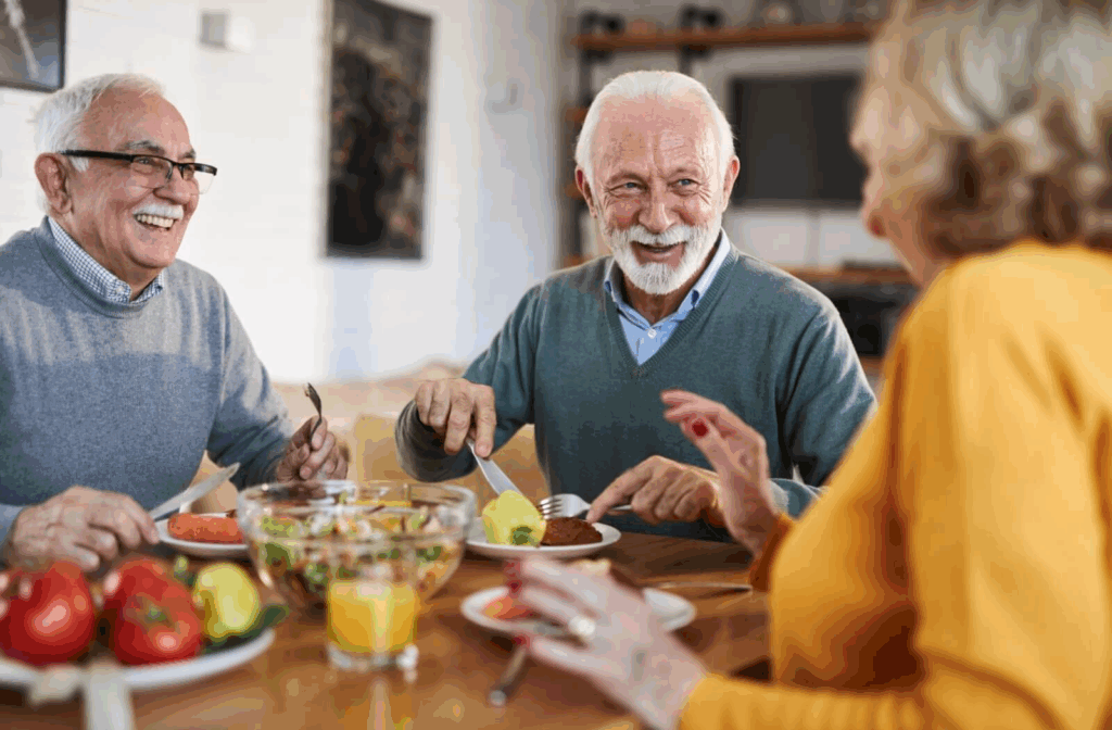 Three friends get together for a meal in the dining area of their independent living community.